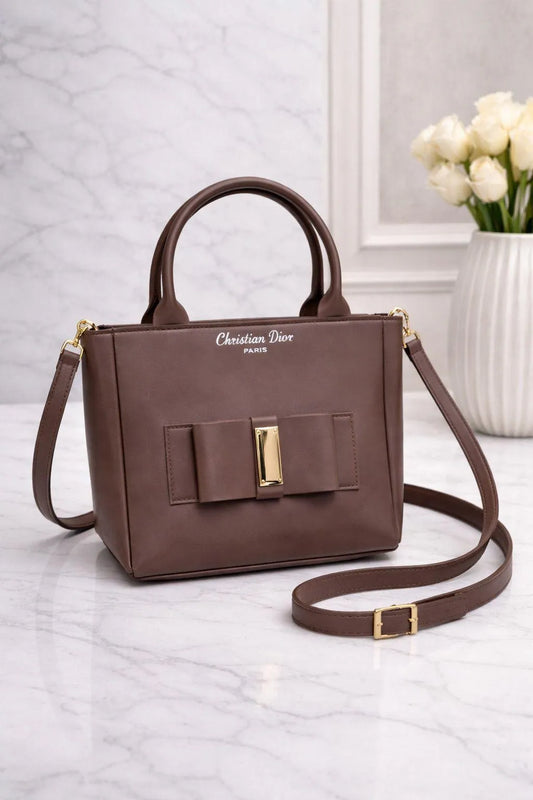 Leather shoulder bag for girls with bow design stylish compact handbag for school college and casual daily use