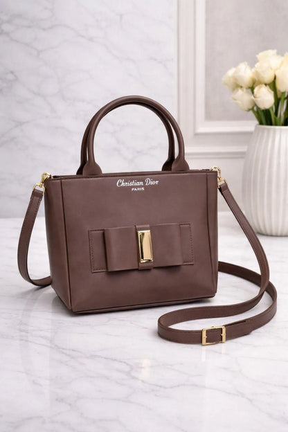 Leather shoulder bag for girls with bow design stylish compact handbag for school college and casual daily use