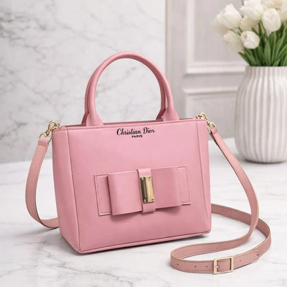 Leather shoulder bag for girls with bow design stylish compact handbag for school college and casual daily use