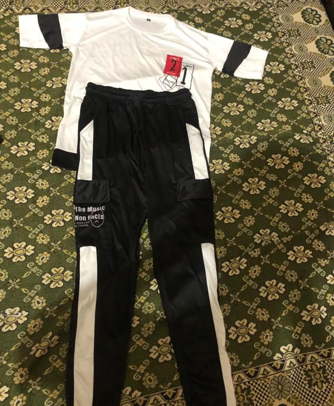 Men white micro interlock graphic 2pc tracksuit with black accents and striped trousers for summer casual and daily wear
