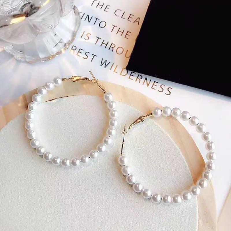 Elegant white pearl hoop earrings with gold-toned hooks for women