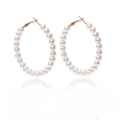 Elegant white pearl hoop earrings with gold-toned hooks for women
